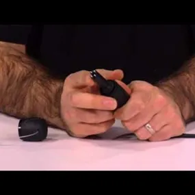 Hands holding Neutrik opticalCon 